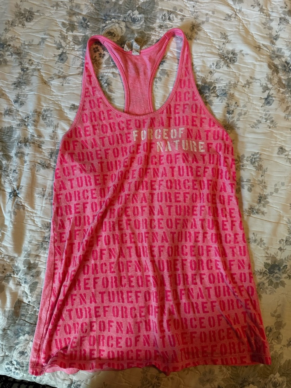 Under Armour Pink Racerback Tank with Repeating 'Force of Nature' Text